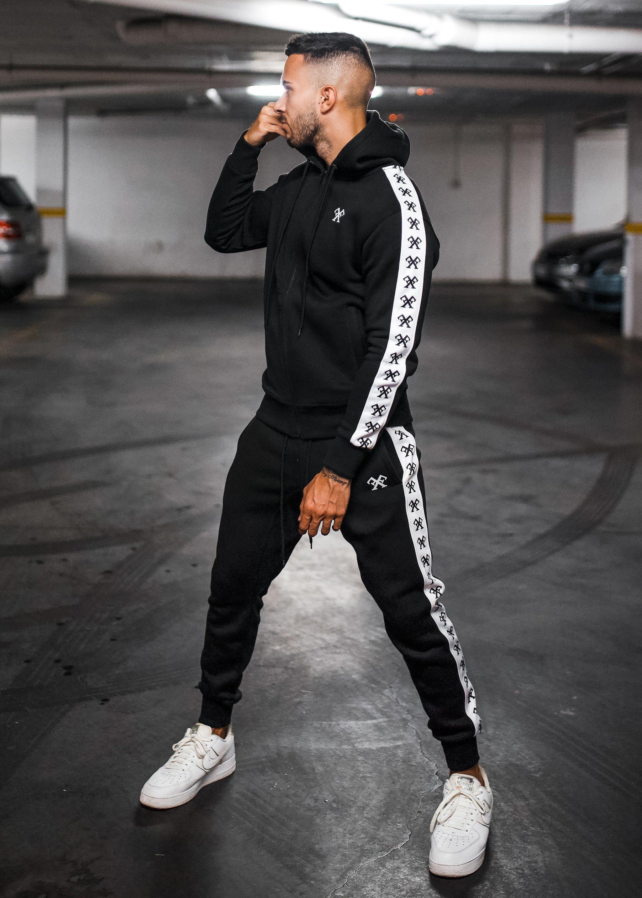 https://www.foreveroriginal.co.uk/cdn/shop/products/Piping-Tracksuit-Hoody-Black-Tracksuits-Forever-Faithless-5_915a798a-405d-45d5-b204-9d11fd768b41_2048x.jpg?v=1628772308
